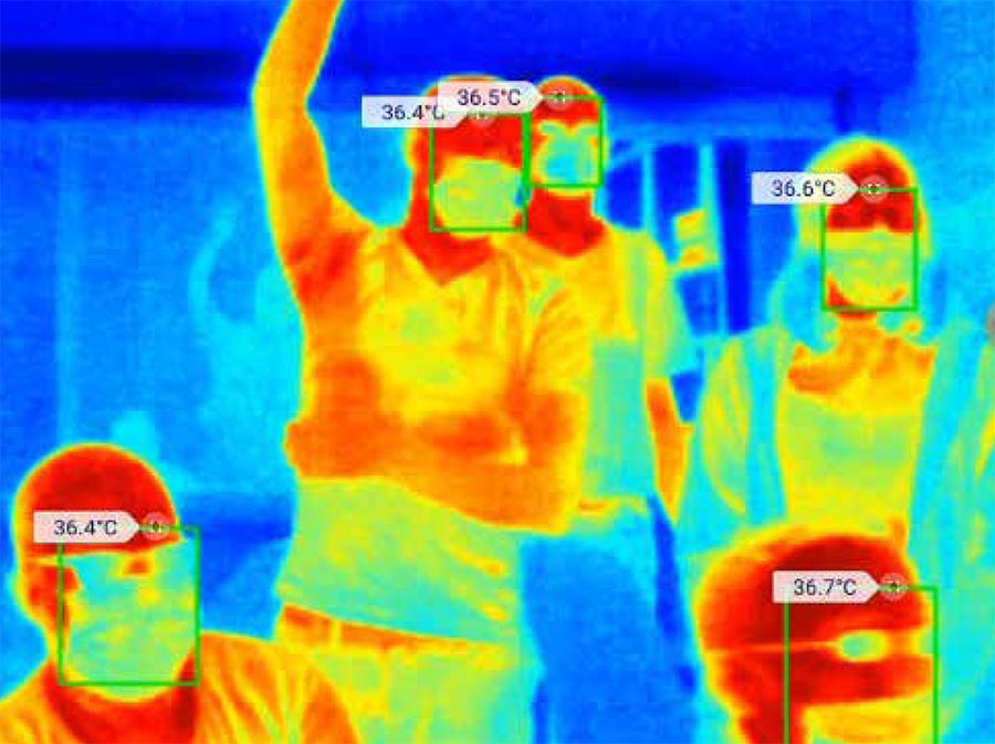 Thermal image of a group of people with their temperatures listed